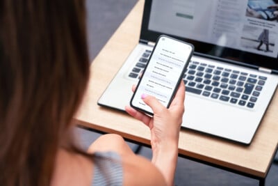 Person checking email inbox on smartphone