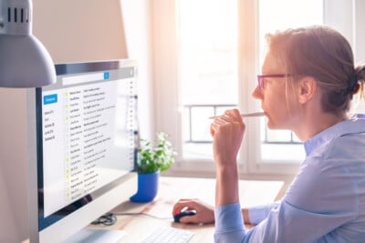 Person checking their email inbox at home.