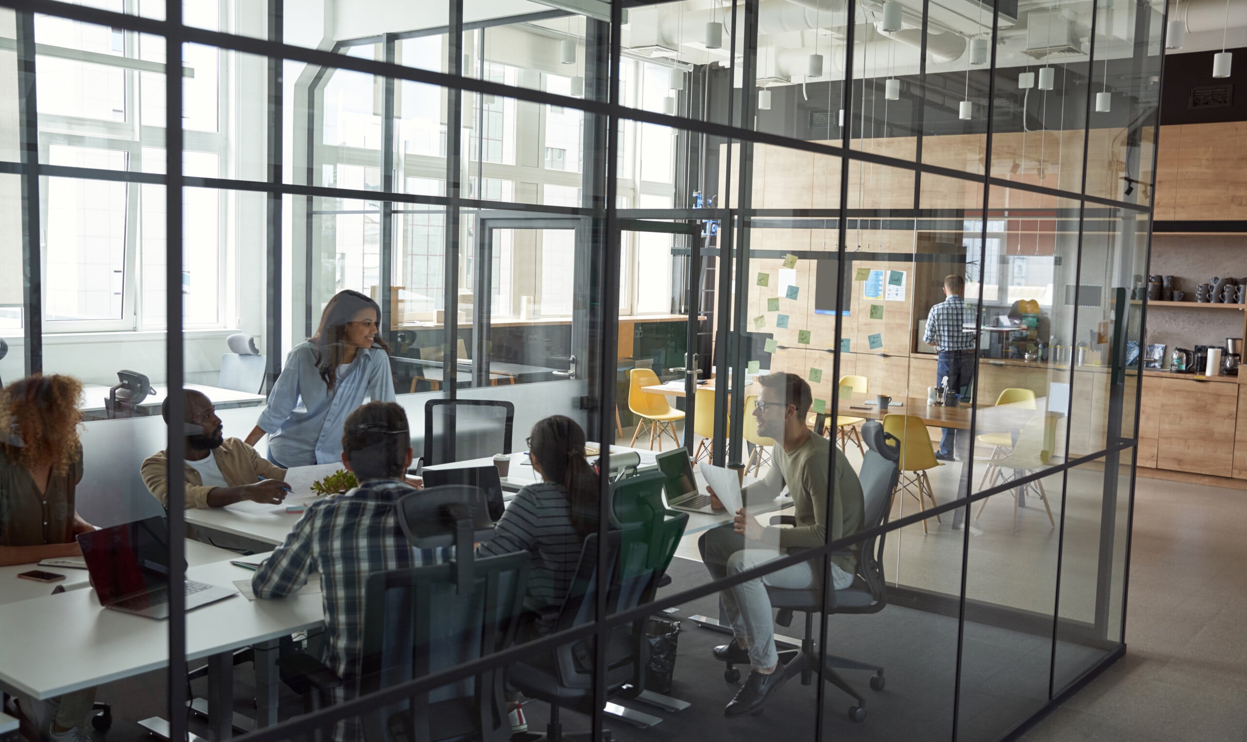 Business meeting Group of happy smiling multiracial business people discussing project working together while sitting in a conference room in the modern coworking space