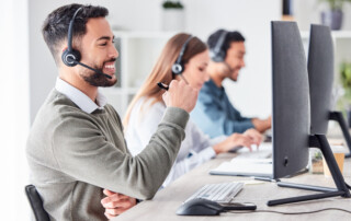 team working in an office with headset computer for online customer support service