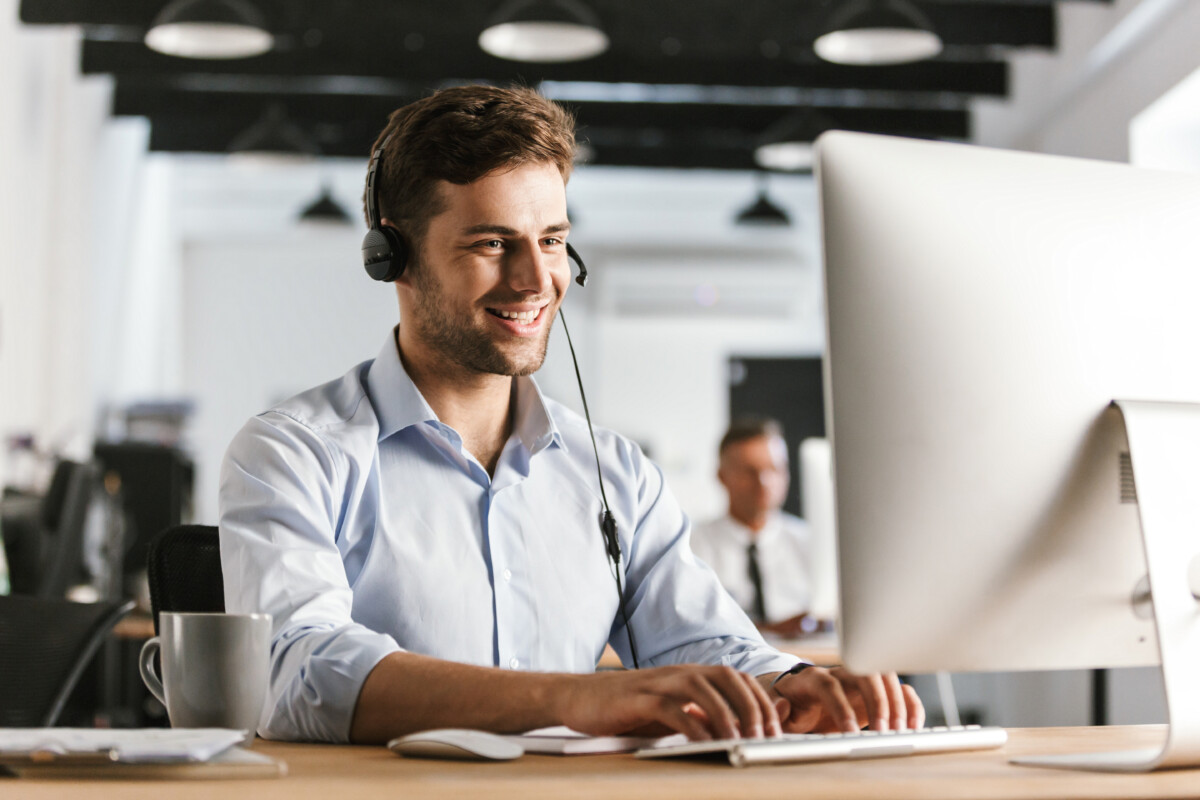 Photo of man wearing office clothes and headset