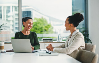 business women in office with feedback on corporate performance review
