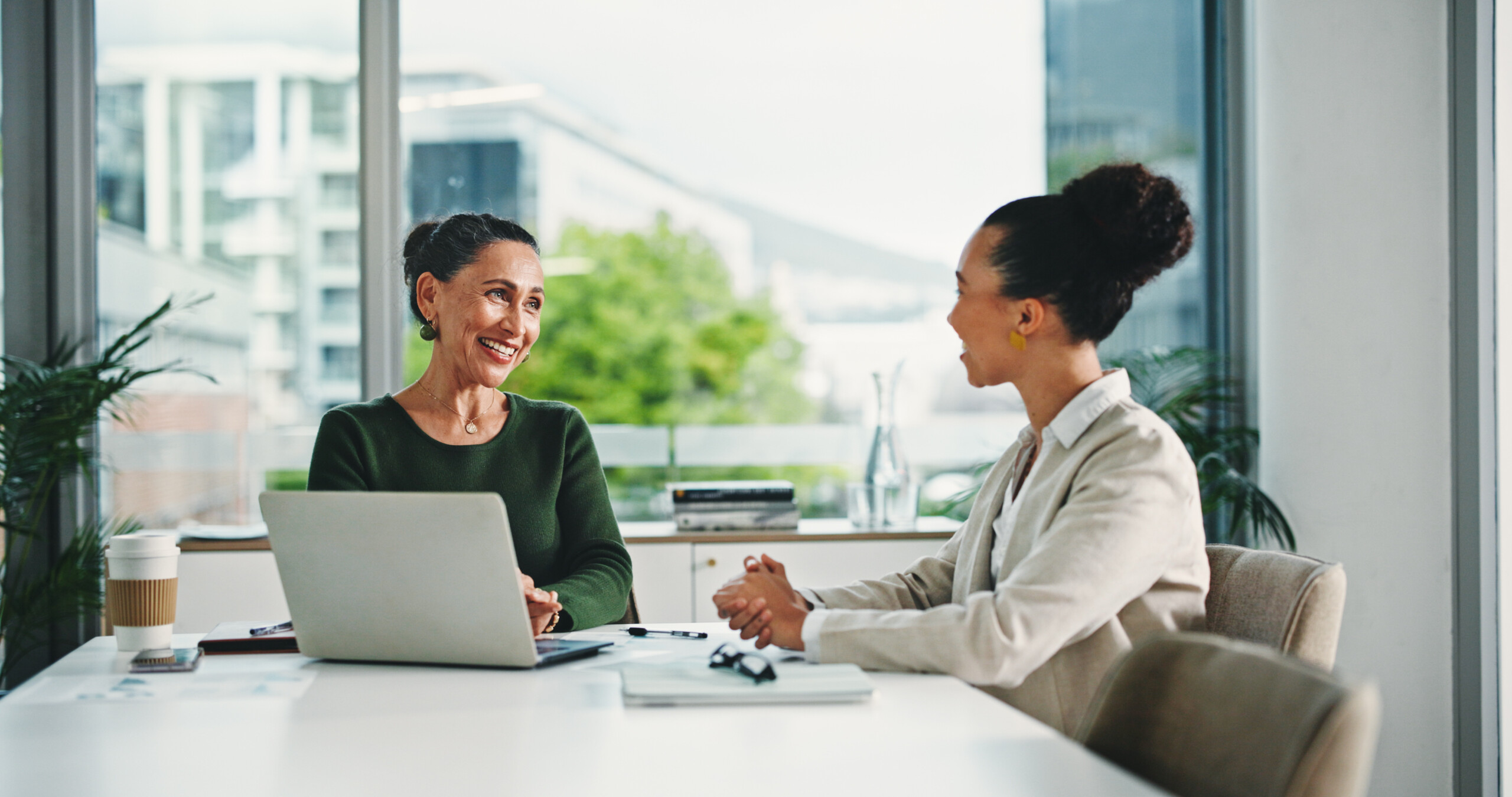 business women in office with feedback on corporate performance review