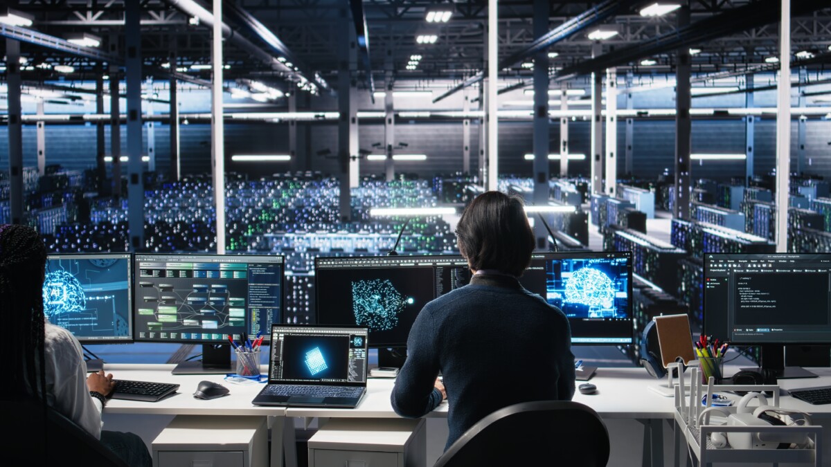 Programmer entering server room office using AI to review infrastructure diagnostics