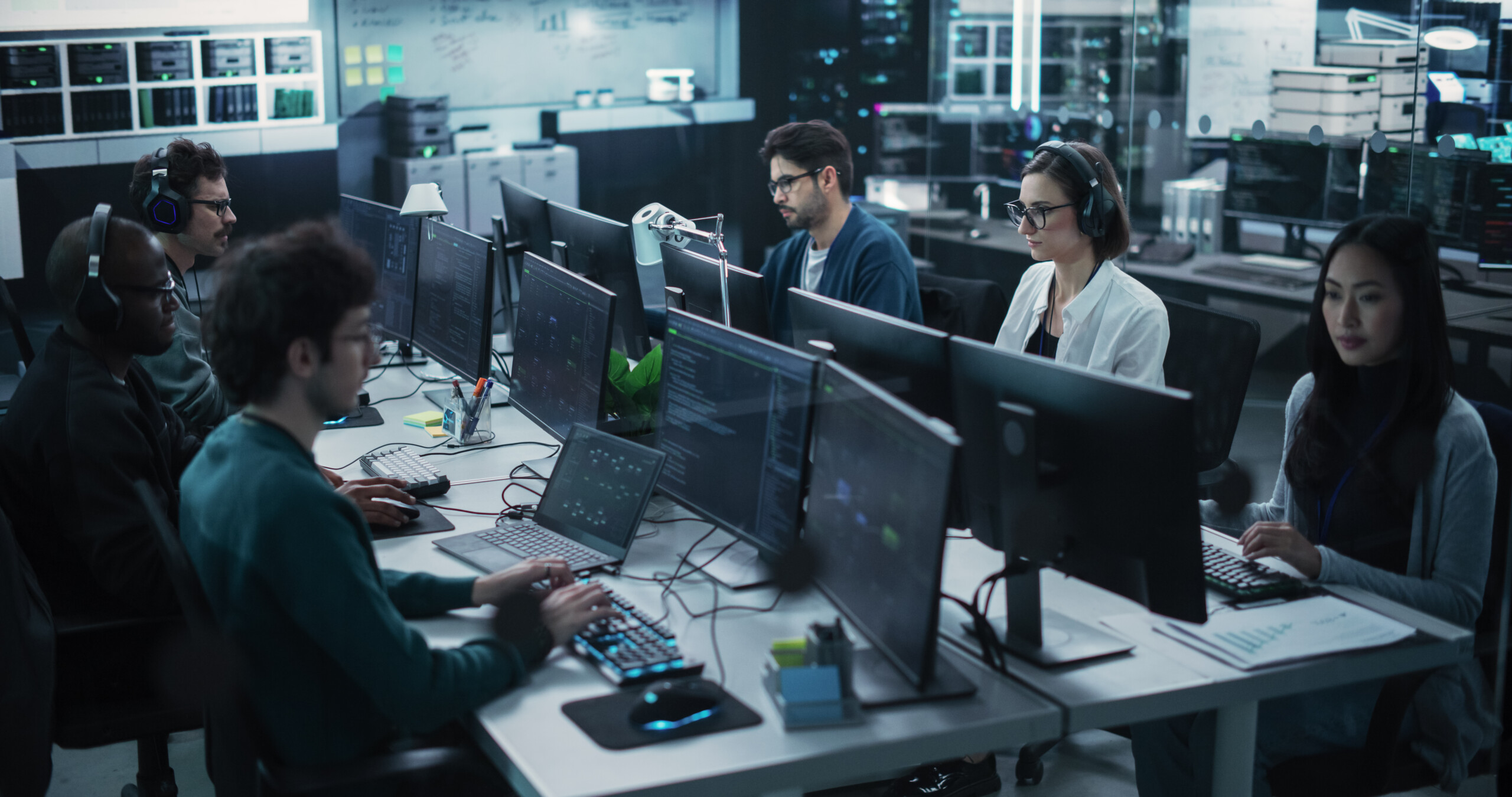 Team of Six Software Developers Working on Computers Programming