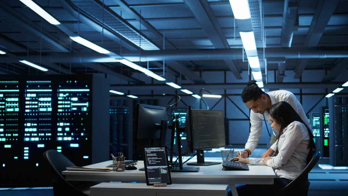 Team of specialists updating server room systems