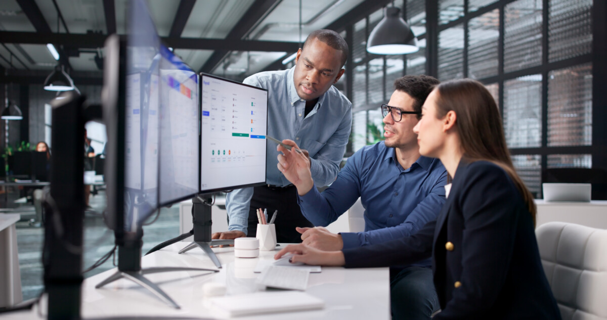 Office Setting Features Team reviewing dashboard