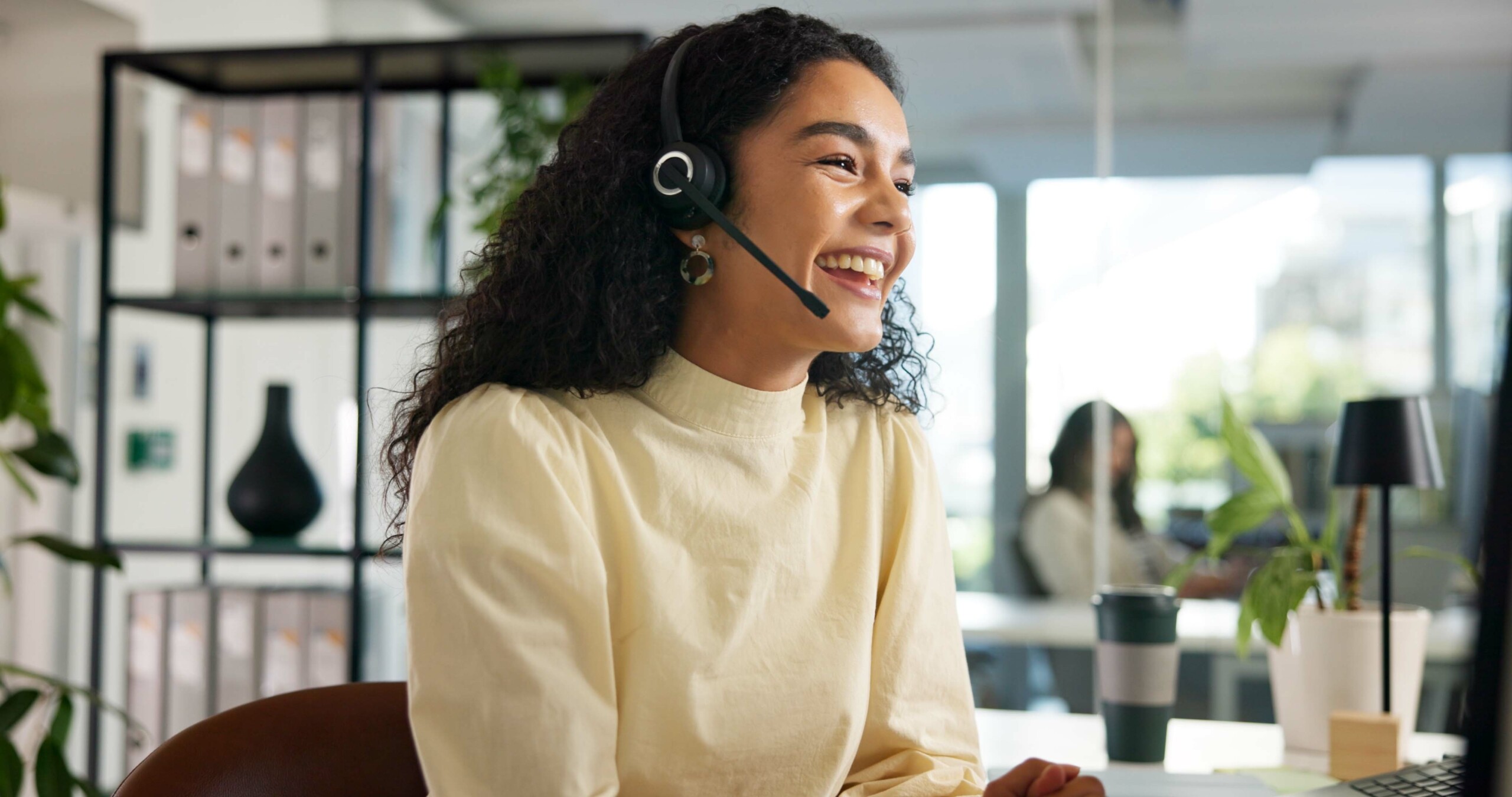 Laughing woman in customer service