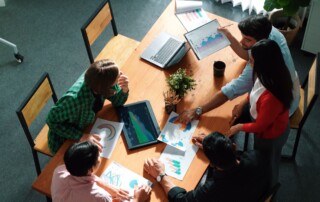 Top view of manager presenting financial graph