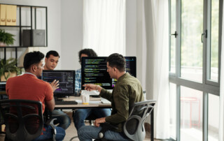 Developers Discussing Programming Code