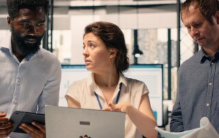 Diverse work team reviewing business intelligence reports