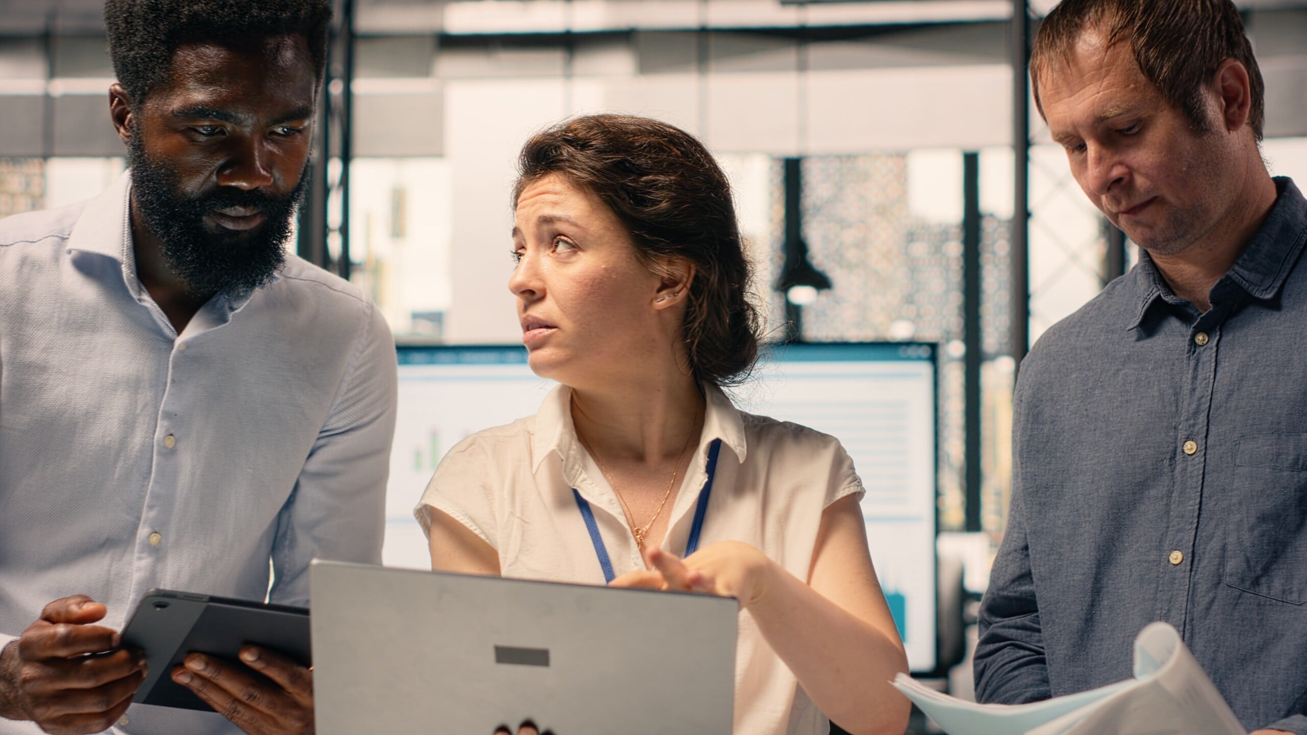 Diverse work team reviewing business intelligence reports