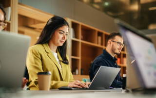 Creative Team Members Using Laptops