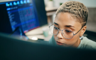 Computer, cyber security and face of woman programming ERP software, cybersecurity system or algorithm code. Programmer, developer or coding machine learning cloud computing server or IT database